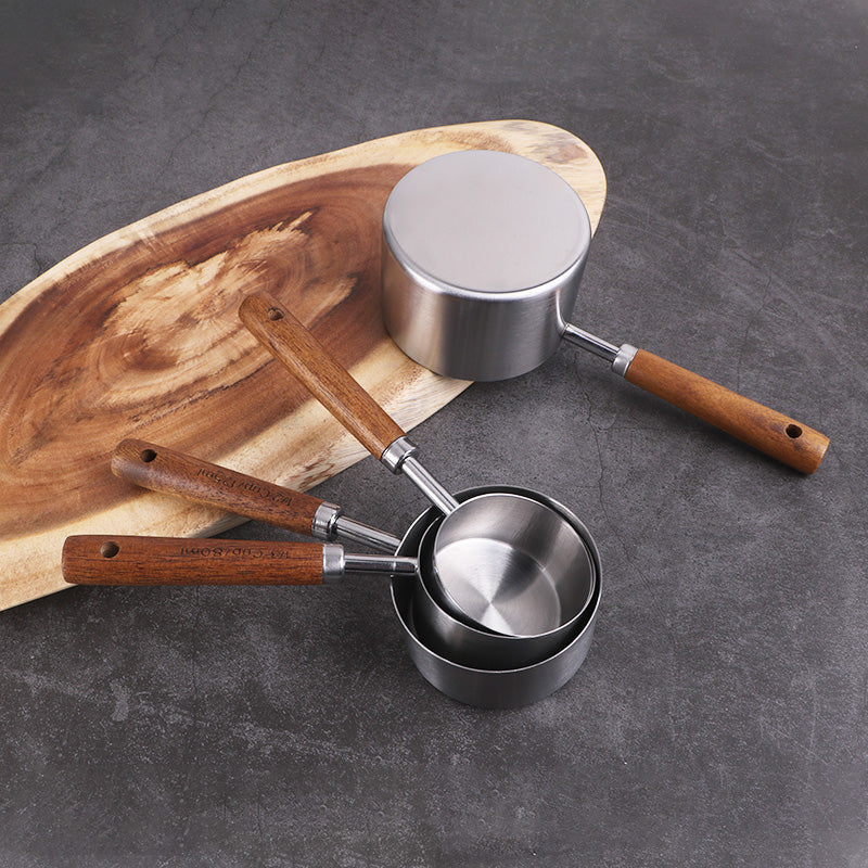 A Stainless steel measuring cup measuring spoon Acacia wooden handle baking tool