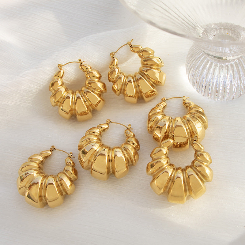A: European and American fashion temperament, retro exaggerated titanium steel earrings, stainless steel plated, 18K thread, concave and convex geometric earrings, women